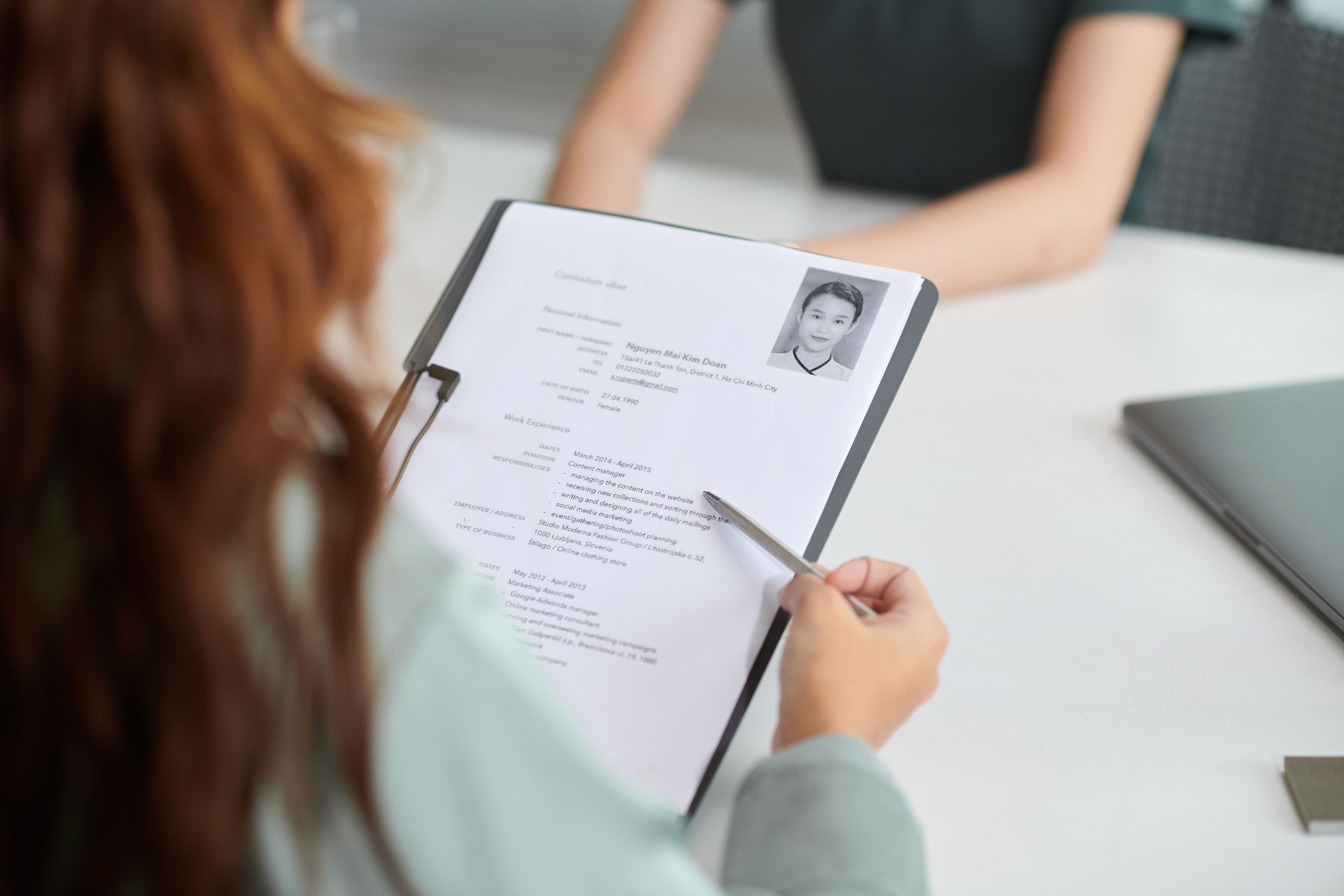 HR Manager Reading CV of Applicant